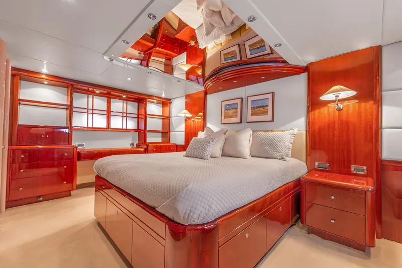 Slide: The Image of Luxurious bedroom interior of 2002 Lazzara 80 Skylounge yacht with elegant wood finishes. - 36