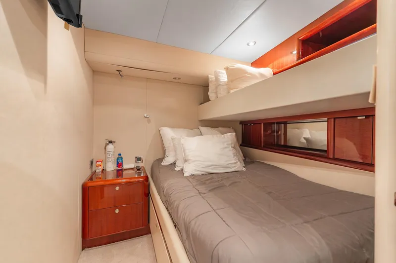 Slide: The Image of Cozy bedroom in 2002 Lazzara 80 Skylounge yacht with bunk beds and wooden accents. - 37