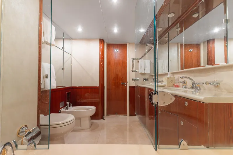 Slide: The Image of Luxurious bathroom in 2002 Lazzara 80 Skylounge yacht with elegant wood and glass accents. - 38