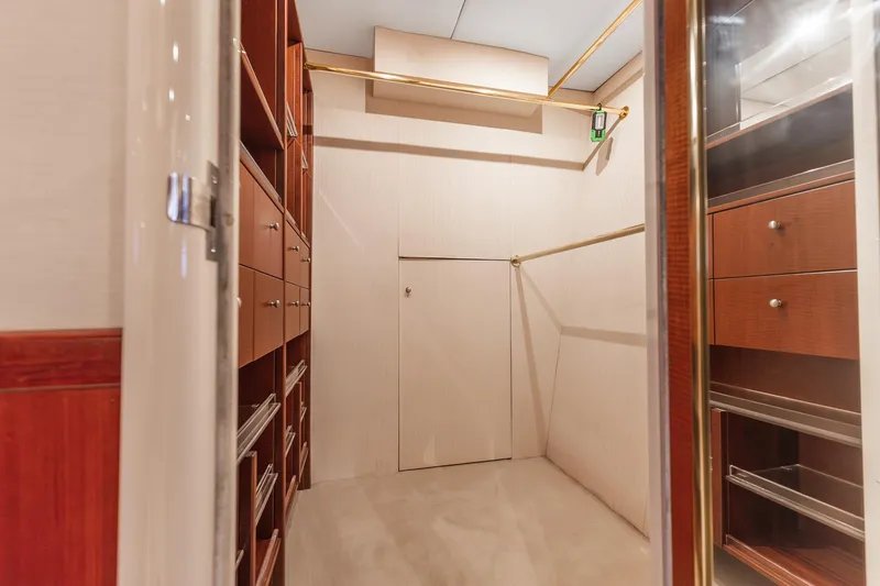Slide: The Image of Luxurious wooden closet interior on a 2002 Lazzara 80 Skylounge yacht. - 39