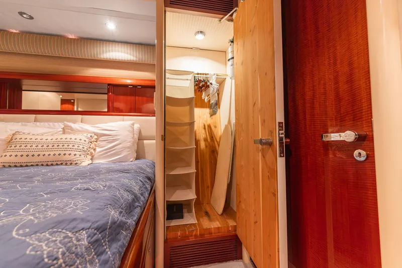 Slide: The Image of Luxurious bedroom interior of 2002 Lazzara 80 Skylounge yacht with closet and elegant bedding. - 42