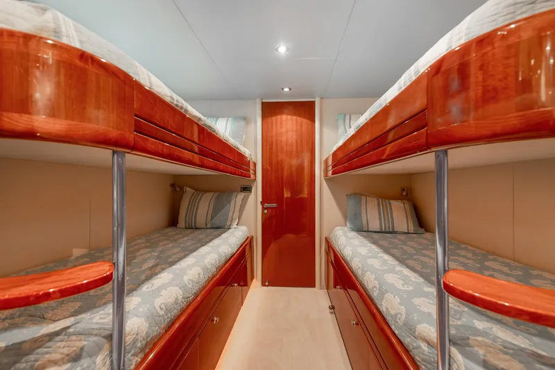 Slide: The Image of Luxurious 2002 Lazzara 80 Skylounge yacht cabin with elegant wooden bunk beds. - 49