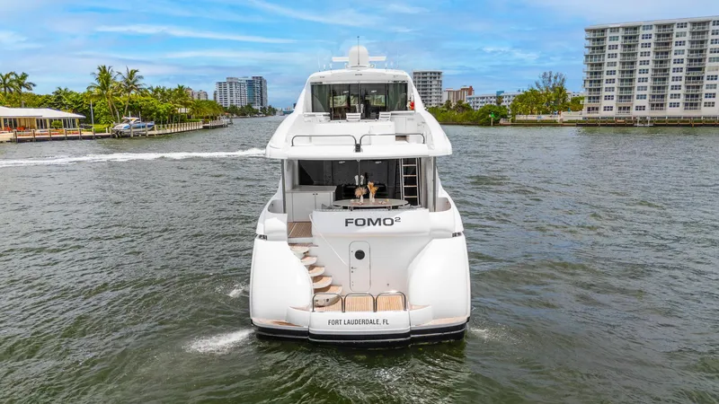 Slide: The Image of Lazzara 80 Skylounge yacht cruising in Fort Lauderdale, 2002 model, rear view. - 5