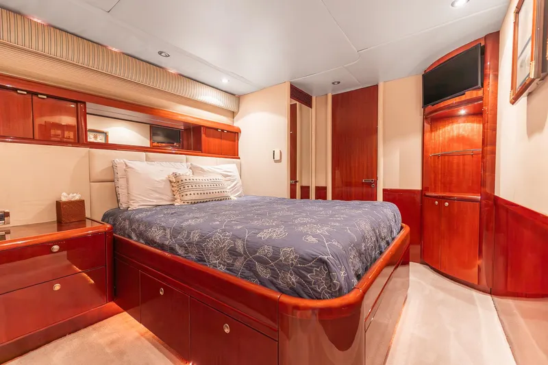 Slide: The Image of Luxurious bedroom interior of 2002 Lazzara 80 Skylounge yacht with elegant wood finishes. - 50