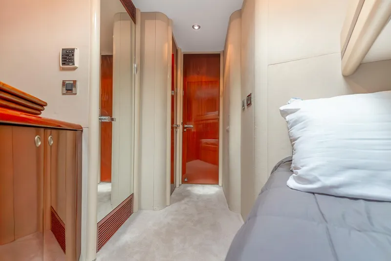 Slide: The Image of Luxurious interior of 2002 Lazzara 80 Skylounge yacht cabin with elegant wood finishes. - 51