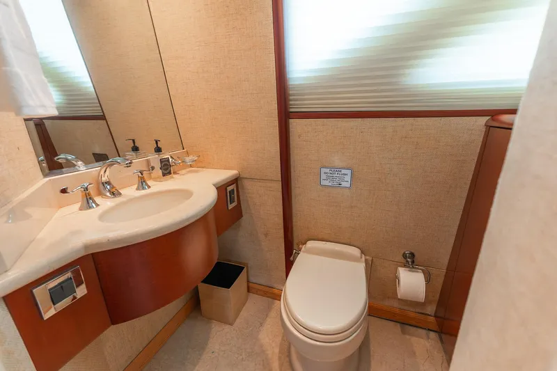 Slide: The Image of Luxurious bathroom in 2002 Lazzara 80 Skylounge yacht with modern fixtures and elegant design. - 54
