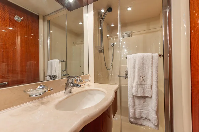 Slide: The Image of Luxurious bathroom in 2002 Lazzara 80 Skylounge yacht with elegant fixtures and glass shower. - 56