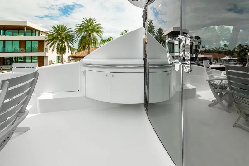 Slide: The Image of Luxurious 2002 Lazzara 80 Skylounge yacht deck with modern seating and sleek design. - 58