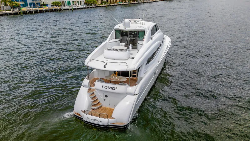 Slide: The Image of Luxury 2002 Lazzara 80 Skylounge yacht cruising in Fort Lauderdale waters. - 7