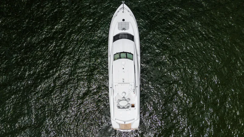 Slide: The Image of Aerial view of 2002 Lazzara 80 Skylounge yacht on open water. - 9