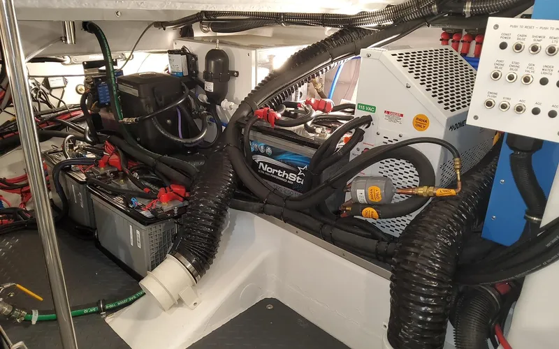 Slide: The Image of Engine room of 2022 Formula 400 Super Sport Crossover with complex wiring and equipment. - 18