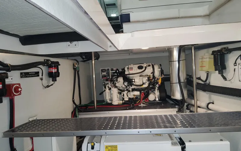 Slide: The Image of Engine room of 2022 Formula 400 Super Sport Crossover, showcasing mechanical components and wiring. - 19