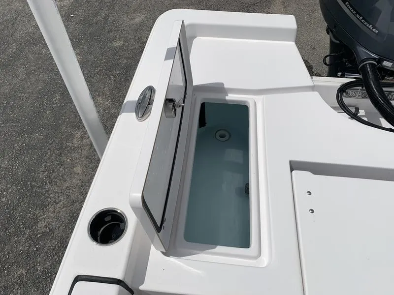 Slide: The Image of 2020 Sportsman Masters 227 boat with open storage compartment on deck. - 13