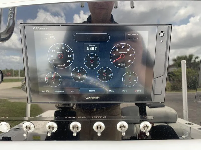 Slide: The Image of Garmin GPS display on 2020 Sportsman Masters 227 boat dashboard, showing various gauges and controls. - 20
