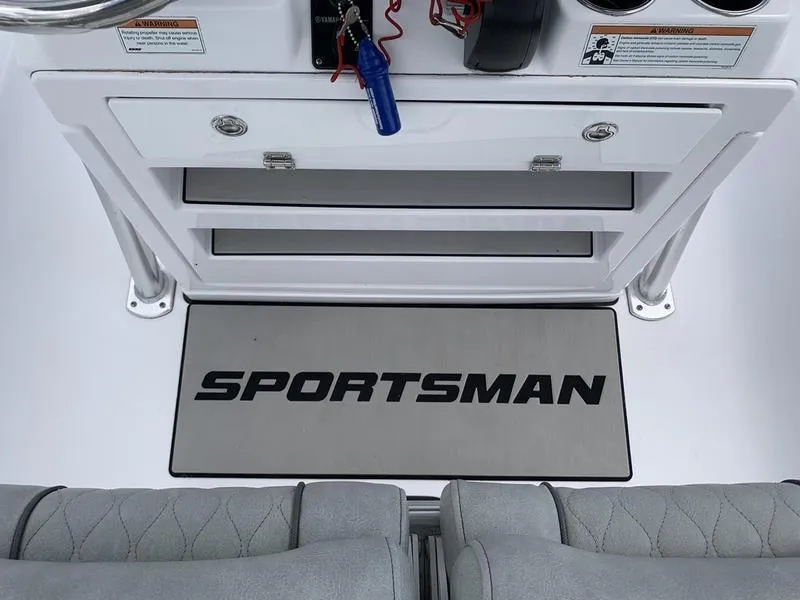 Slide: The Image of 2020 Sportsman Masters 227 boat interior with branded mat and storage compartments. - 23