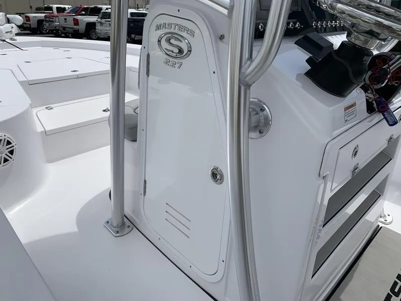 Slide: The Image of 2020 Sportsman Masters 227 boat interior with console and seating area. - 25