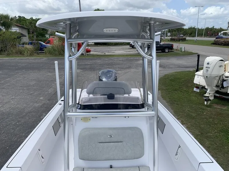 Slide: The Image of 2020 Sportsman Masters 227 boat with T-top and center console, parked outdoors. - 29