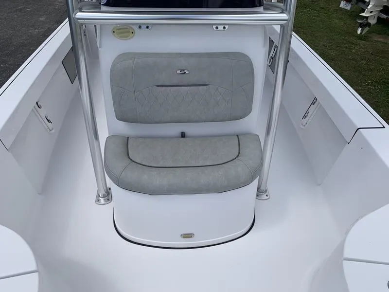 Slide: The Image of 2020 Sportsman Masters 227 boat interior with cushioned seating and sleek design. - 30