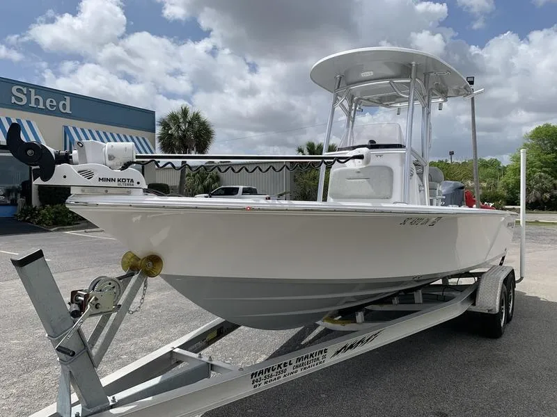 Slide: The Image of 2020 Sportsman Masters 227 boat on trailer, parked outdoors under cloudy sky. - 8