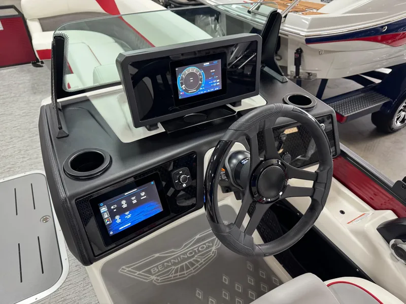 Slide: The Image of Dashboard of 2025 Bennington 24 ML boat with modern steering and digital displays. - 14