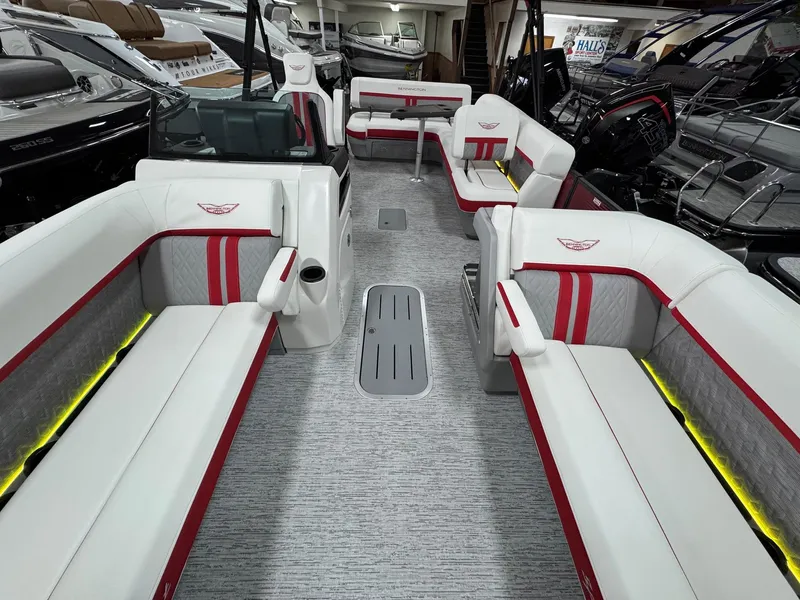 Slide: The Image of 2025 Bennington 24 ML boat interior with white and red seating, modern design. - 5