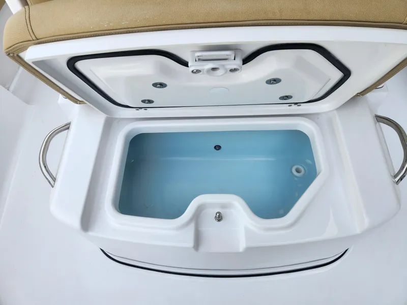 Slide: The Image of Livewell compartment on 2025 Sportsman Masters 247 Bay Boat, open lid view. - 14