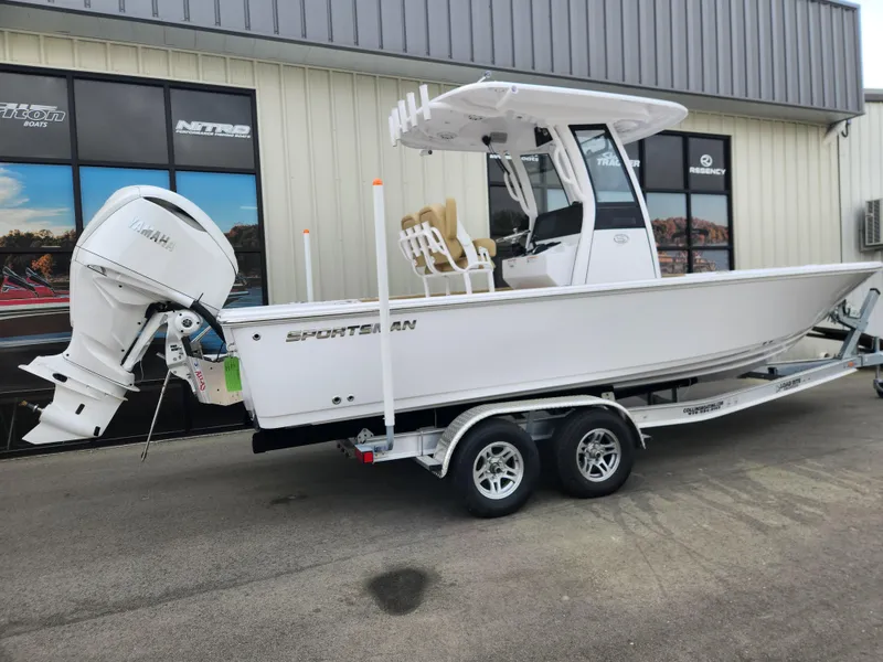 Slide: The Image of 2025 Sportsman Masters 247 Bay Boat on trailer, parked outside a building. - 3