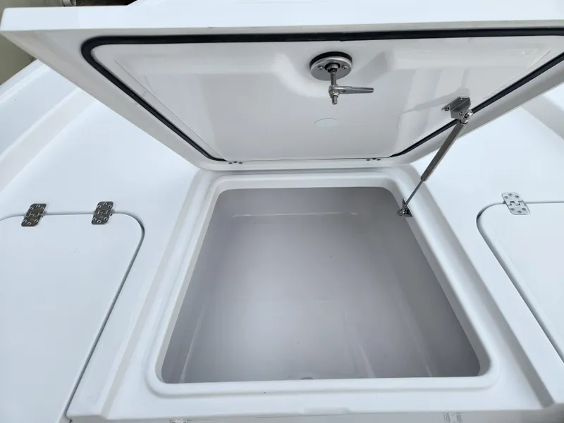 Slide: The Image of Open storage compartment on 2025 Sportsman Masters 247 Bay Boat. - 9