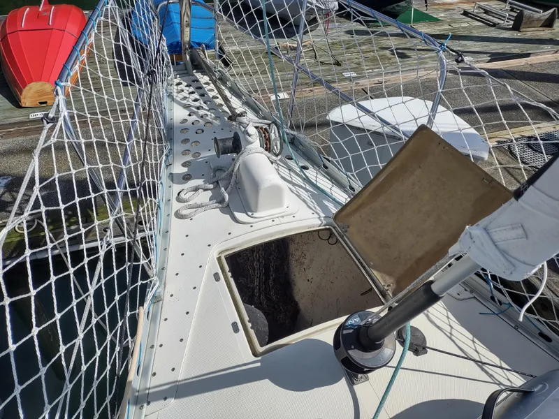 Slide: The Image of Sailboat deck of 1988 Cascade 42 with open hatch and safety netting. - 18