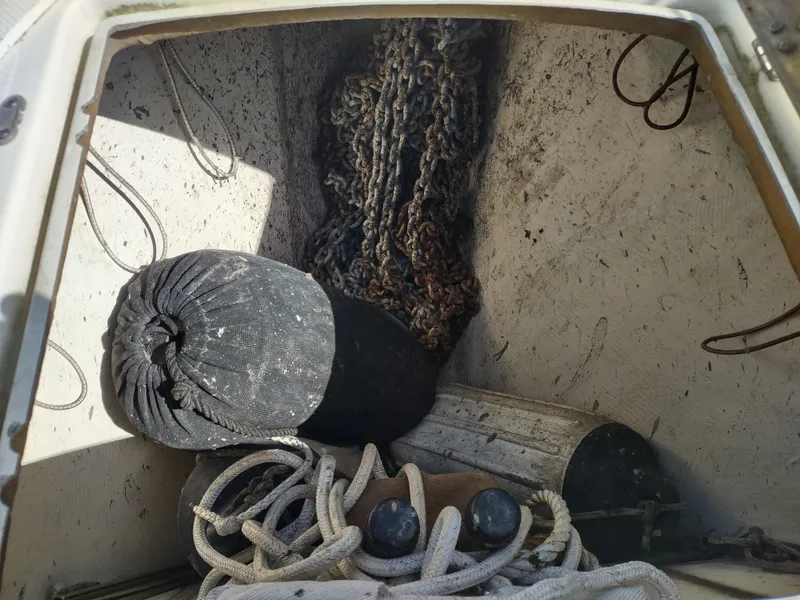 Slide: The Image of Storage compartment of 1988 Cascade 42 boat with ropes and fenders. - 19