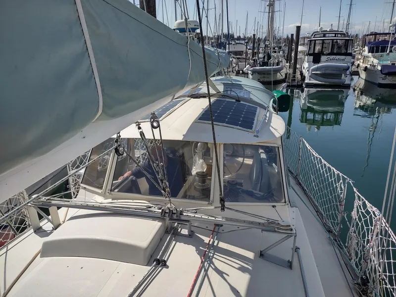 Slide: The Image of Sailboat docked in marina, Cascade 42 model, 1988, with solar panel on deck. - 22