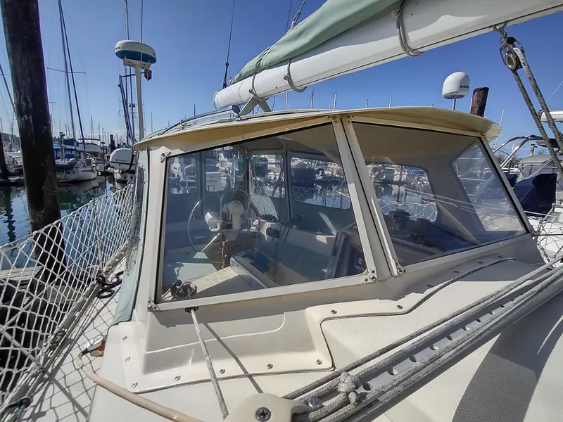 Slide: The Image of Sailboat Cascade 42, 1988 model, docked in marina with clear blue sky. - 24