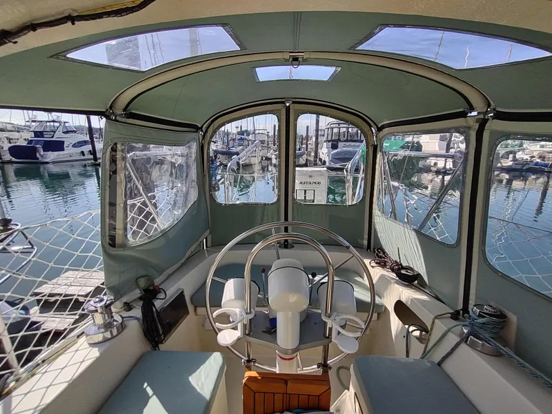 Slide: The Image of Cockpit view of 1988 Cascade 42 sailboat docked in a marina. - 27