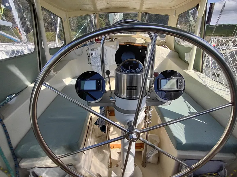 Slide: The Image of Cockpit of 1988 Cascade 42 sailboat with steering wheel and navigation instruments. - 31