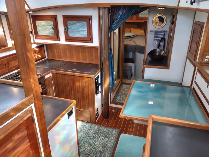 Slide: The Image of Interior of 1988 Cascade 42 sailboat with wood finishes and modern amenities. - 37