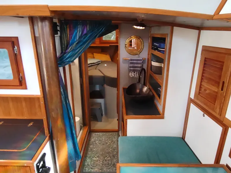 Slide: The Image of Interior of 1988 Cascade 42 sailboat with cozy cabin and nautical decor. - 48
