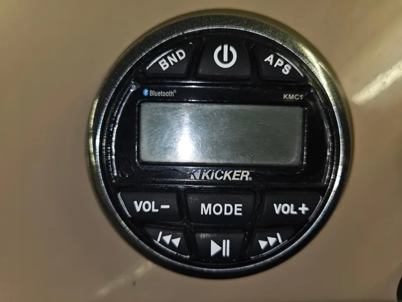 Slide: The Image of Kicker KMC1 audio control panel with Bluetooth, featuring volume and mode buttons. - 6