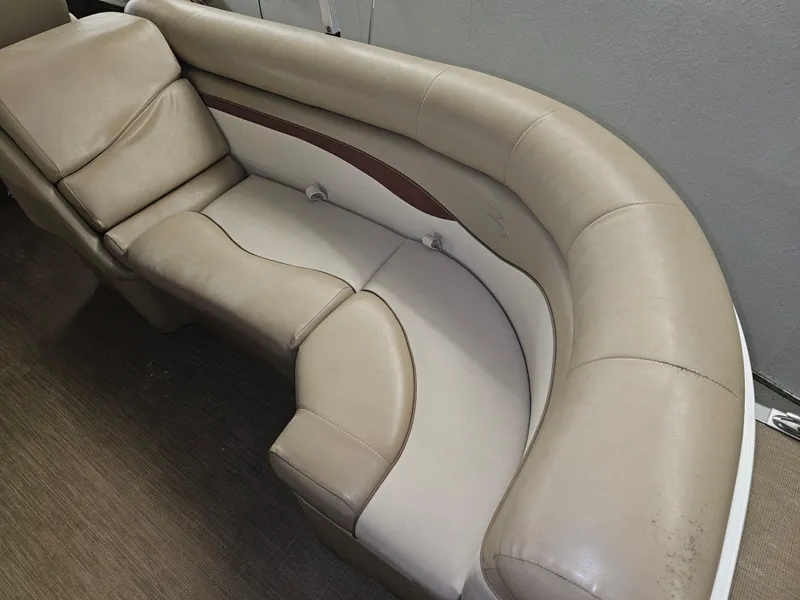 Slide: The Image of 2018 Bennington SX25 boat interior with beige leather seating. - 9