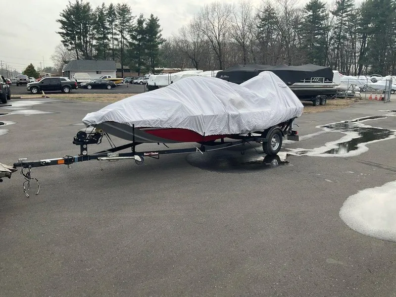 Slide: The Image of 2020 Tracker BASS TRACKER® Classic XL boat covered on trailer in parking lot. - 12