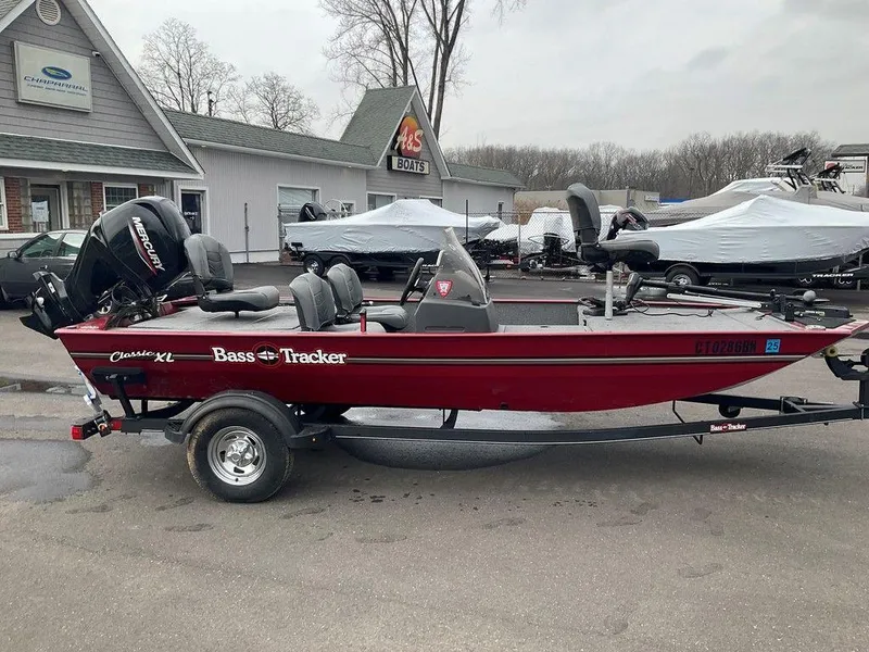 Slide: The Image of 2020 Tracker BASS TRACKER® Classic XL boat on trailer, parked outdoors. - 14