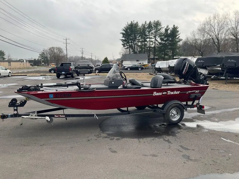 Slide: The Image of 2020 Tracker BASS TRACKER® Classic XL boat on trailer in parking lot. - 15