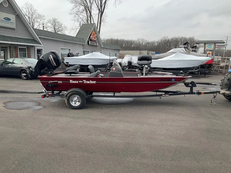 Slide: The Image of 2020 Tracker BASS TRACKER® Classic XL boat on trailer, parked outdoors. - 16