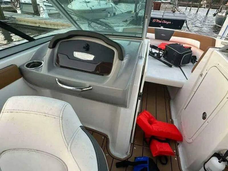 Slide: The Image of 2023 Chaparral 230 SSi boat interior with seating and safety gear. - 3