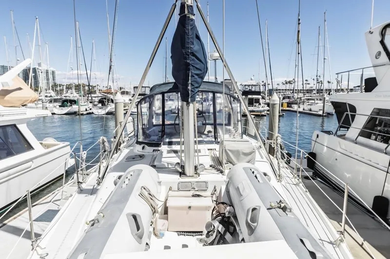 Slide: The Image of Sailboat docked in marina, Hunter 456 model, 1997, surrounded by other boats. - 15