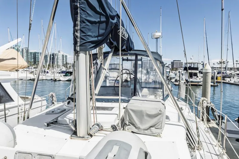 Slide: The Image of Sailboat docked in marina, Hunter 456 model, 1997, with clear blue sky. - 16