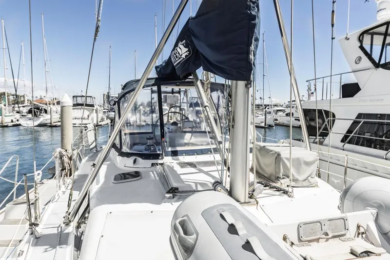 Slide: The Image of Sailboat deck view, 1997 Hunter 456, docked in a marina with clear blue skies. - 17