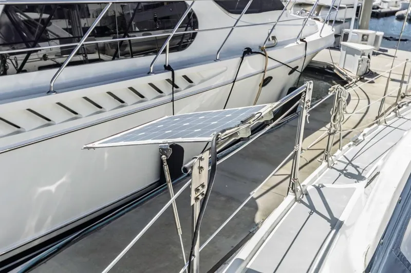 Slide: The Image of Sailboat with solar panel, Hunter 456 model, 1997, docked at marina. - 23