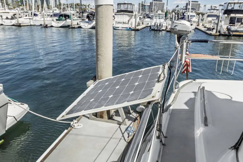 Slide: The Image of Hunter 456 sailboat with solar panel docked at marina, 1997 model. - 25