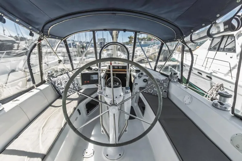 Slide: The Image of Cockpit of a 1997 Hunter 456 sailboat with steering wheel and navigation equipment. - 26