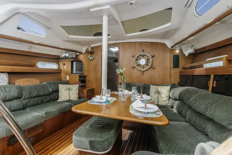 Slide: The Image of Interior of a 1997 Hunter 456 yacht with cozy seating and dining area. - 33